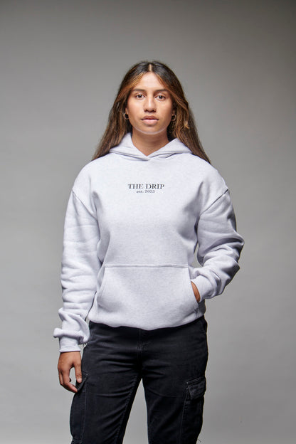 The Drip Hoodie in Light Grey worn by a female model