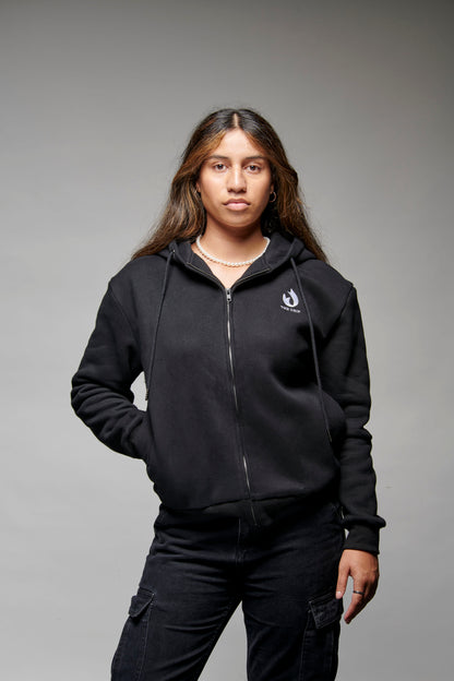 The Drip Zip in Black worn by a female model